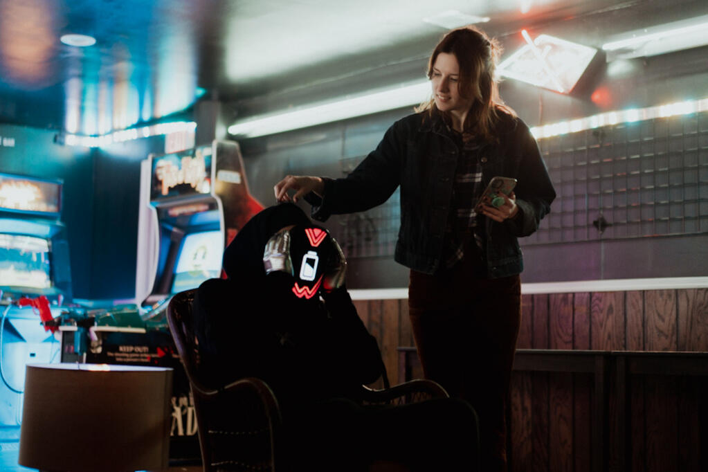 Adjusting LED mask on set
